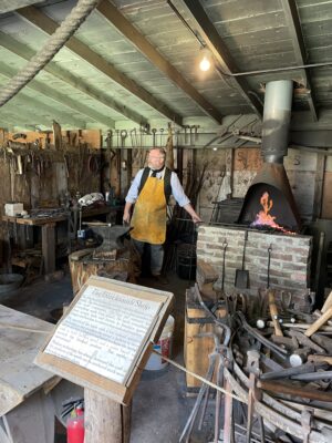 Blacksmith demonstrating pioneer skills.