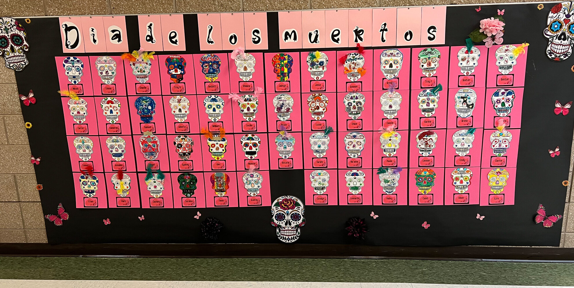 Poster of skulls decorated for Dia de Los Muertos