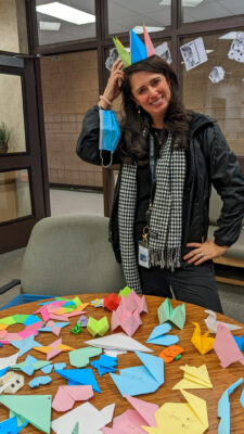 Teacher with origami display.