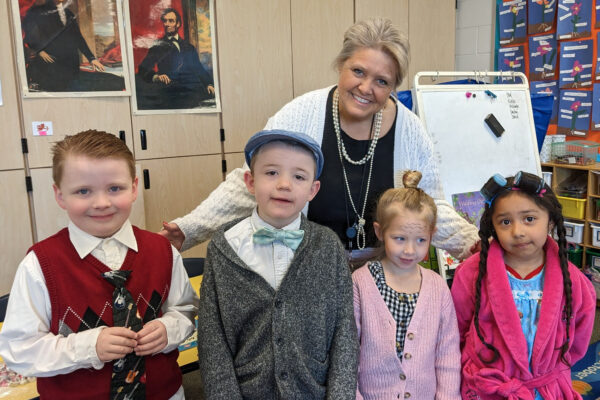 Teacher and students dressed as if they are 100 years old.
