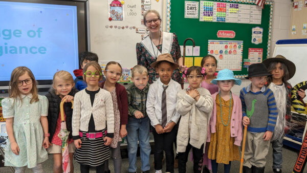 Teacher and students dressed as if they are 100 years old.
