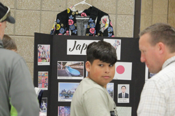 Young man with Japan display.
