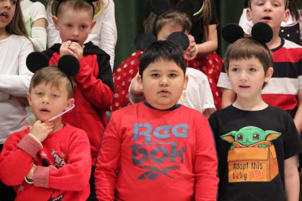 Young children preparing to sing.
