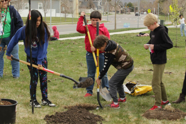 Children digging hole.
