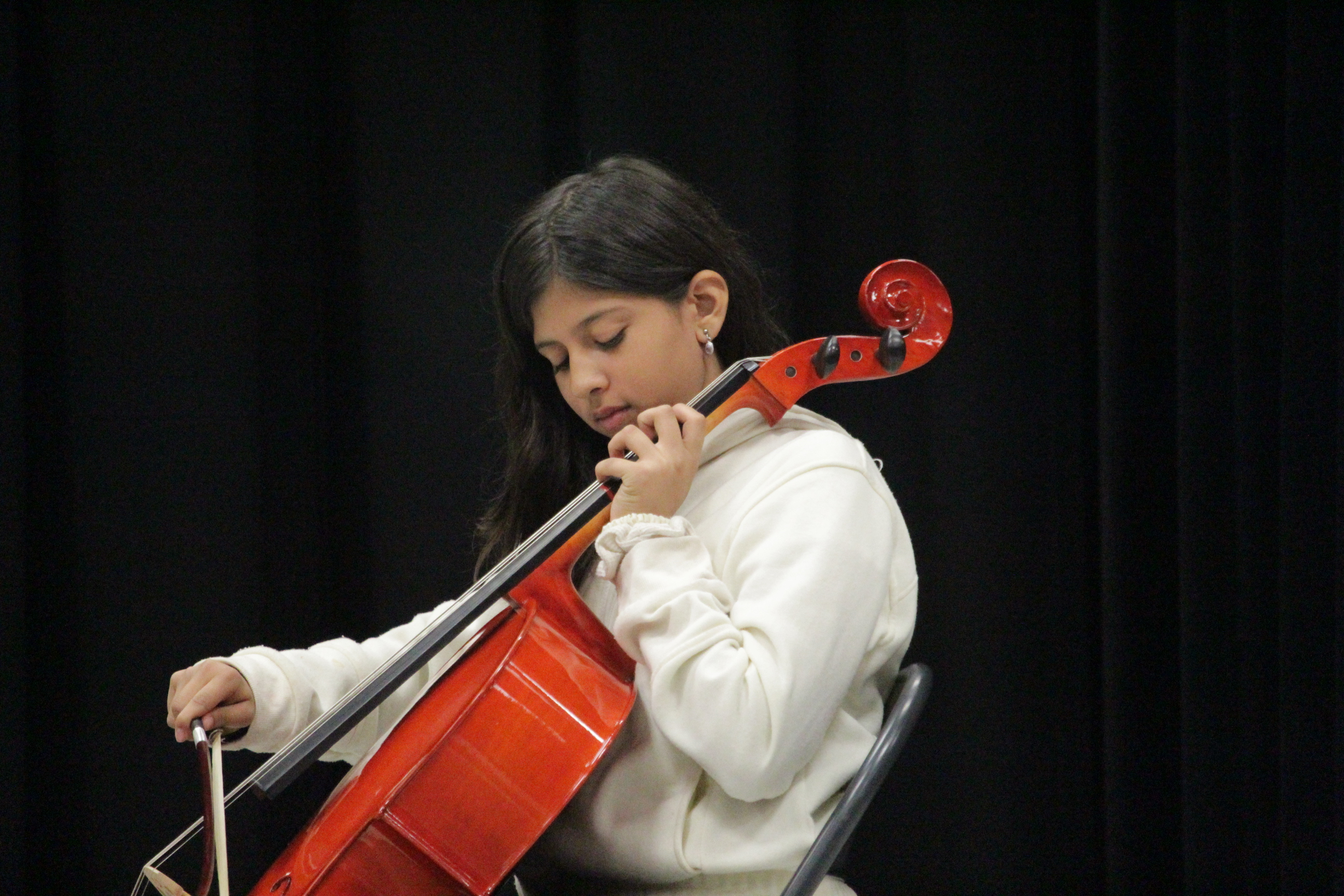 Young woman playing the cello.