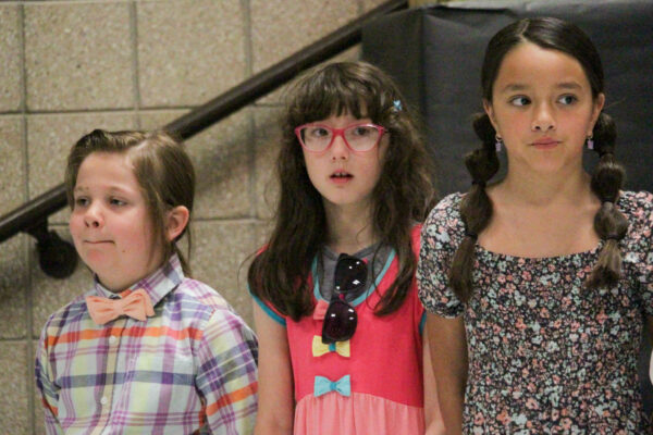 Second grade students waiting to sing.