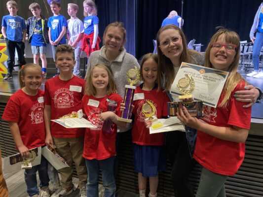 3rd and 4th grade students receive first place award with Mrs. Eataugh and Pro. Rossi.
