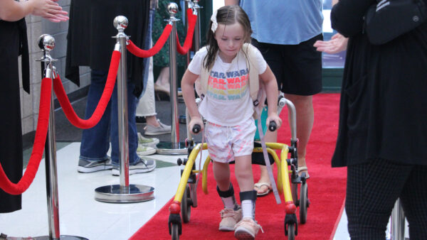Young girl walking the red carpet.