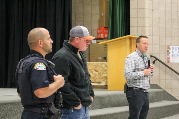 Mr. Mangum introducing two police officers.