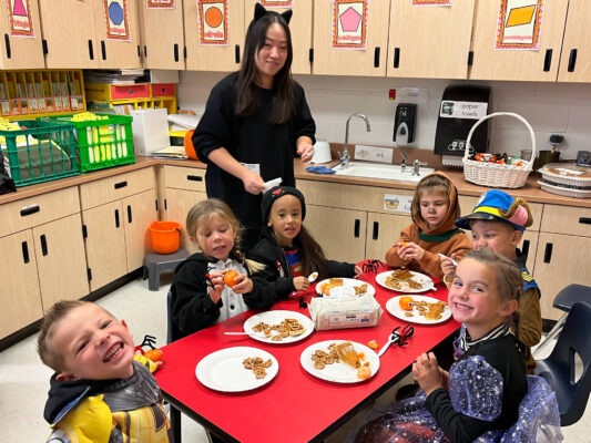 Students enjoying pumpkin pie.