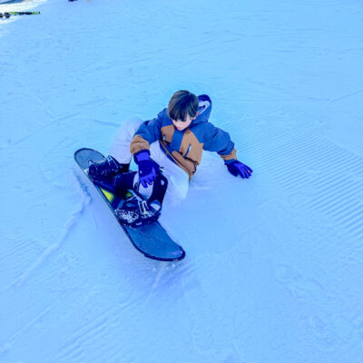 Student learning to snowboard.