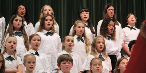 Students singing during choir performance.