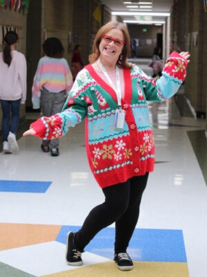 Staff member displays her favorite sweater.
