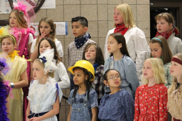 Students singing during program.