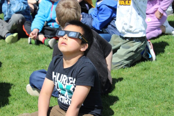 Student watching the eclipse.