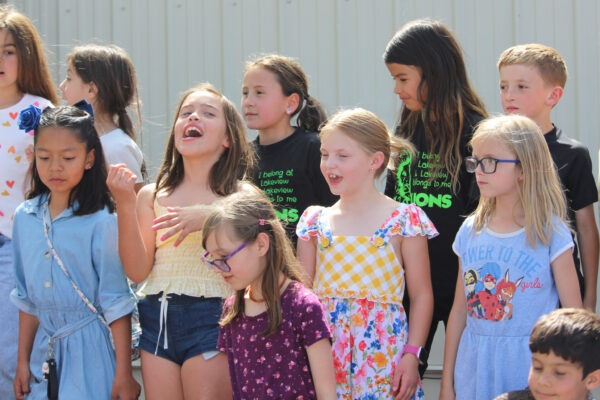 Second grade children singing.