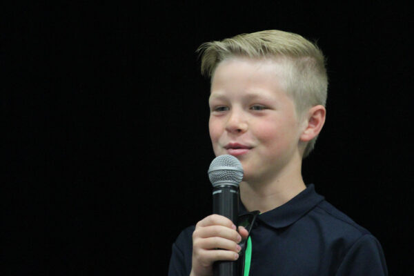 Boy with microphone.