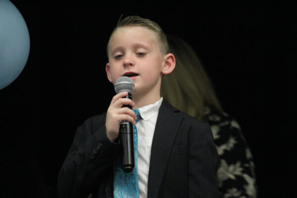 Boy with microphone.