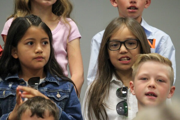 Children singing.