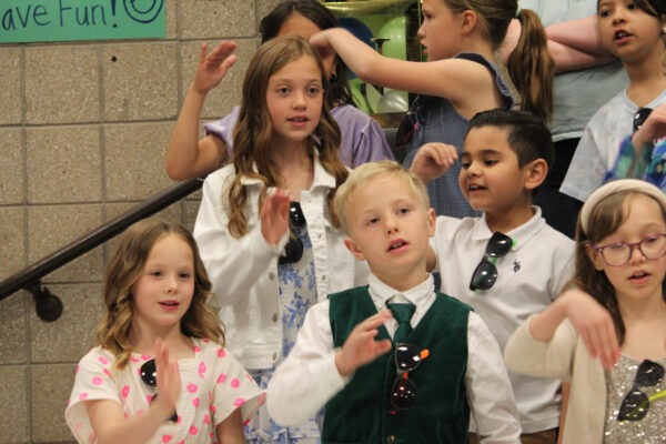 Children singing.