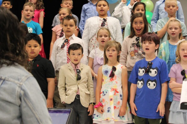 Children singing.