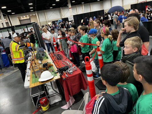 students watch an instructor