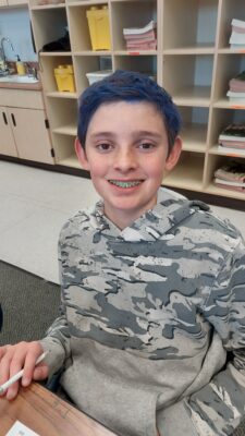 boy student smiling at the camera